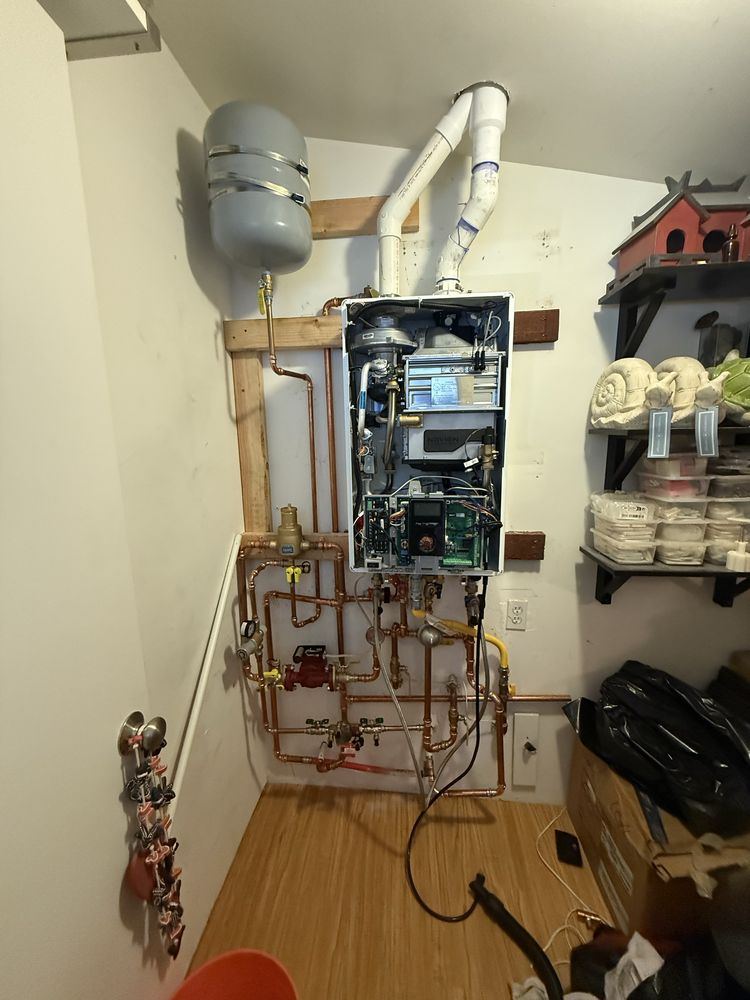 Licensed 5Star Plumbing Pro technician installing a tankless water heater